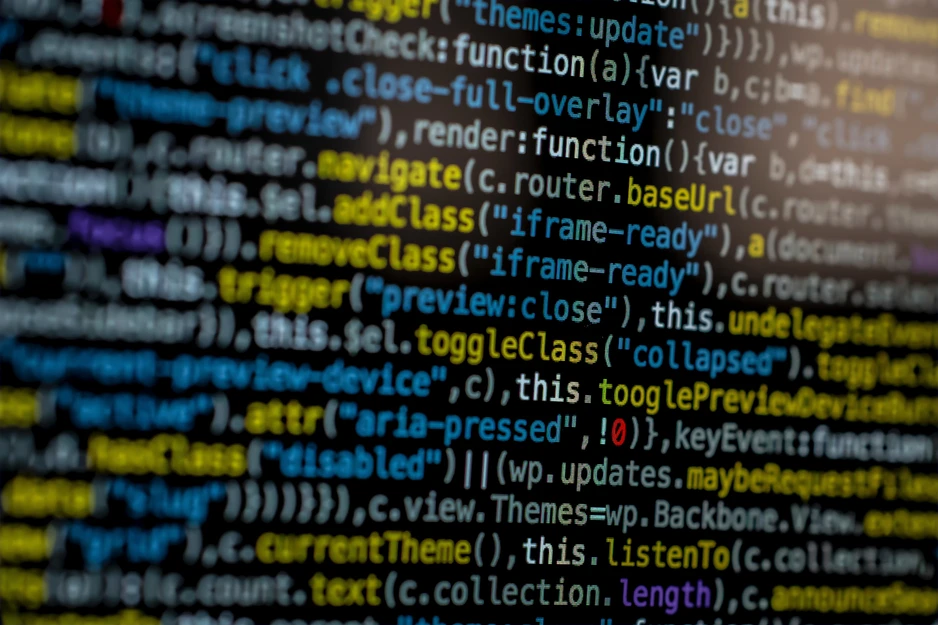 Programmer's hands typing on keyboard