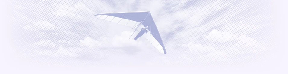 Hang glider in sky